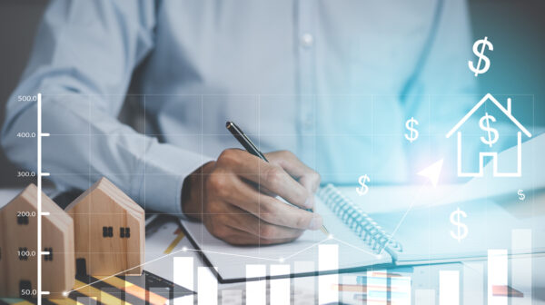 Concept financial transactions online, businessman holding pen and point at financial analyzing data while discussion, planning brand promotion budget, raising company awareness in social media